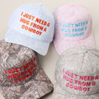 I JUST NEED A HUG FROM A COWBOY Embroidered Camo Trucker Hat