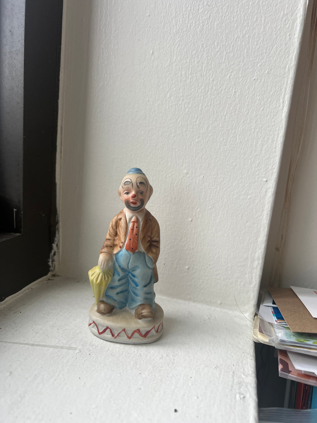Small Clown Figure with Umbrella