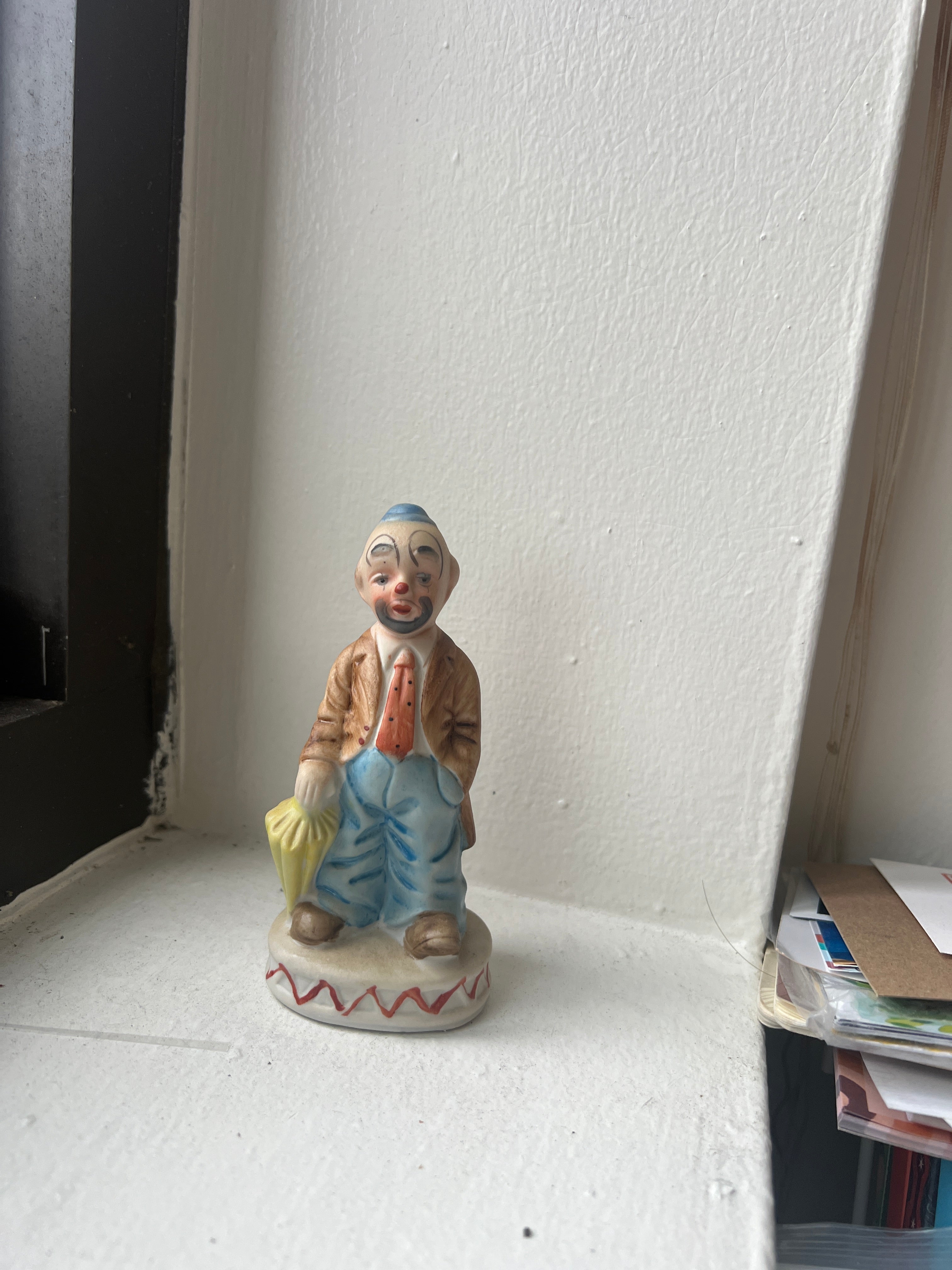 Small Clown Figure with Umbrella