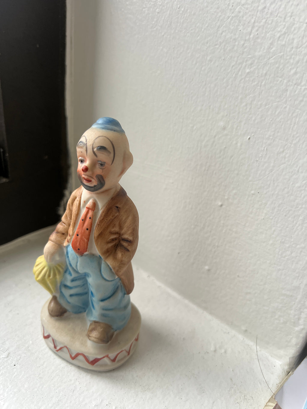 Small Clown Figure with Umbrella