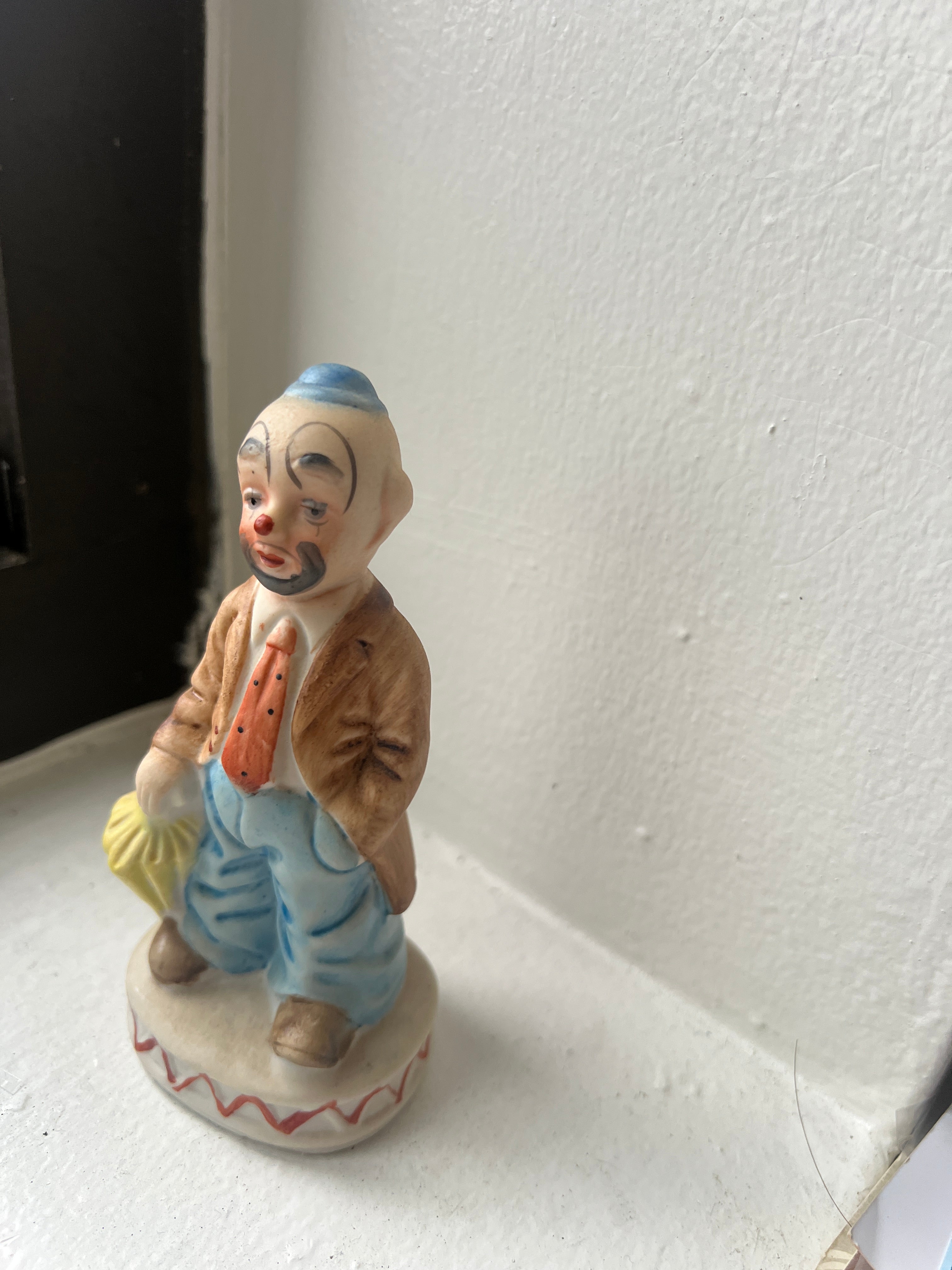 Small Clown Figure with Umbrella