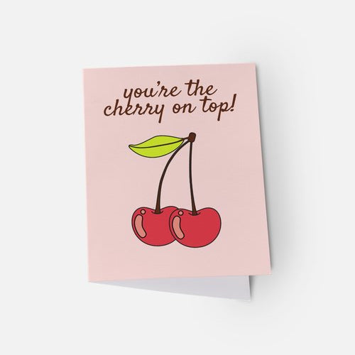 Greeting card with cherries and text on a pink background